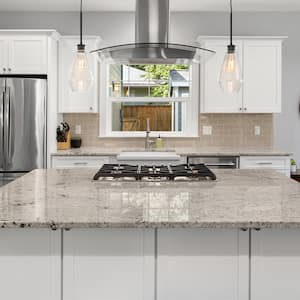 bright new kitchen with beige marble island    
